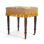 A Regency-style mahogany and part upholstered stool on turned legs with castors CONDITION REPORT: