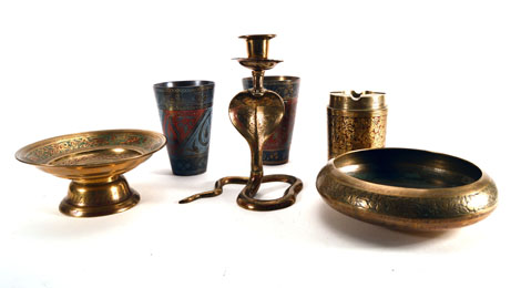 A group of Indian and Eastern brassware including an ashtray of leaf form relief decorated with