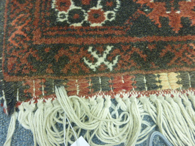 A Turkoman-style runner of Tekke design, the red ground within a matching border, 300 x 80 cm - Image 5 of 8