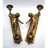A pair of brass Neo Classical-style wall sconces in the form of cherubs, h. 30 cm CONDITION