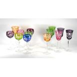 A set of six Bohemian clear and coloured glass goblets, five similar glasses with trumpet shaped