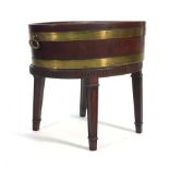 A George III and later mahogany and brass bound oval wine cooler and stand, the later with square