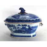 An 18th century Chinese blue and white tureen and cover decorated with fishing townscapes, w. 32