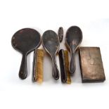 A five piece silver mounted tortoiseshell dressing table set, a silver mounted buffer and a