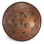 An Indo- Persian Dahl shield, the brass back with four prominent bosses, d. 37 cm CONDITION