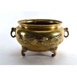 A Japanese Export two handled metalware jardiniere decorated with ducks and a dragon on three