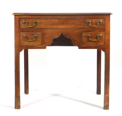 An 18th century fruitwood lowboy, the shaped apron with one long and two short drawers, on square