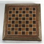 An Indian bone and inlaid chess board, 35 x 35 cm CONDITION REPORT: Significant damage to inlay in