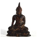 A travelling bronze figure modelled as The Buddha, traces of gilding and red paint, h. 11.5 cm