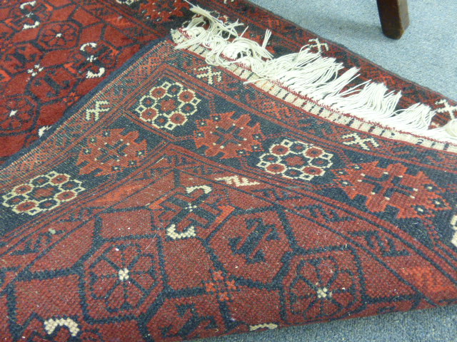 A Turkoman-style runner of Tekke design, the red ground within a matching border, 300 x 80 cm - Image 8 of 8