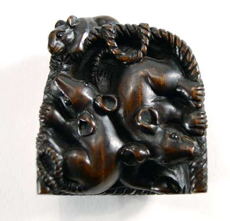 A carved hardwood netsuke modelled as a basket of three rats, l. 5 cm, signed with bone insert verso - Image 2 of 2