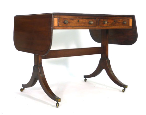 An early 19th century mahogany and strung sofa table with two frieze drawers on two supports with