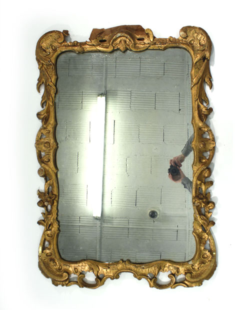 An 18th century-style wall mirror, the rectangular plate within a giltwood frame, h. 110 cm