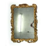 An 18th century-style wall mirror, the rectangular plate within a giltwood frame, h. 110 cm