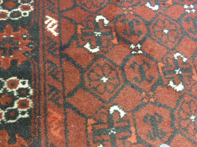 A Turkoman-style runner of Tekke design, the red ground within a matching border, 300 x 80 cm - Image 6 of 8