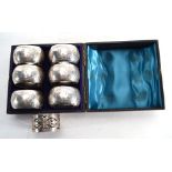 A cased set of six Victorian silver napkin rings with bright cut engraving and numbered 1-6,