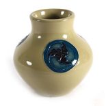 A modern miniature Moorcroft vase of slender baluster form decorated with three Celtic-type