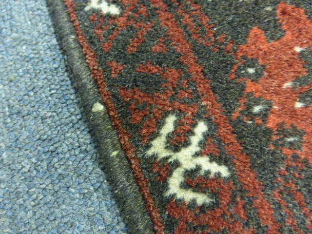 A Turkoman-style runner of Tekke design, the red ground within a matching border, 300 x 80 cm - Image 3 of 8