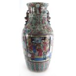 A 19th century Cantonese famille rose vase, the pleated neck above an ovoid body painted with