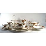 An extensive part twelve sitting Royal Albert 'Country Roses' dinner service including a teapot, a