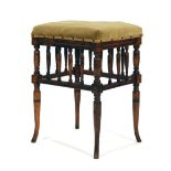 A stained beech stool, the raised seat above a series of spindles on turned supports CONDITION