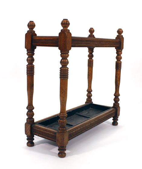 An oak umbrella stand, the top with two turned partitions over a fitted tray joined by turned - Image 2 of 2