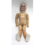A Simon & Halbig bisque headed doll with sleeping brown glass eyes, painted features and open