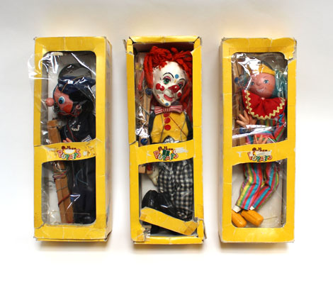 Three Pelham Puppets 'Policeman' and two 'Clowns', each in a yellow window box