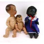 A Pedigree black hard plastic walking doll and two composition dolls CONDITION REPORT: All with