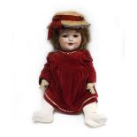 An Armand Marseille bisque headed doll with sleeping brown glass eyes, painted features and open