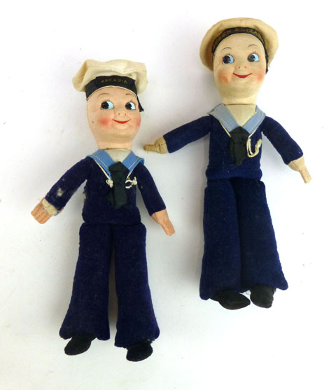 A pair of Empire pressed felt sailor dolls 'Queen Elizabeth' and 'Arcadia', h. 21 cm, in the manner