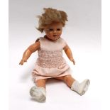 A 1950's French Raynal hard plastic fully jointed doll with flirty eyes and original shoes, h. 47