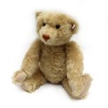 A Steiff fully jointed 'Teddy Bear', blonde mohair, black boot button eyes and vertically stitched