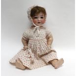 A Heubach Koppelsdorf bisque headed doll with sleeping brown glass eyes, painted features and open