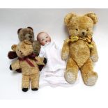 An Armand Marseille 'Dream Baby' doll, head stamped, '351/3/12K', h. 35.5 cm and three stuffed bears