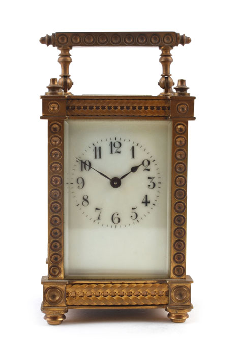 A 19th century carriage clock, the enamelled dial with Arabic numerals within a brass five-glass