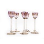 A set of five 19th century Venetian liqueur glasses, the gilt decorated and 'jeweled' mauve bowls