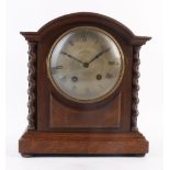 A late 19th/early 20th century mantle clock, the face with Roman numerals within an oak and barley