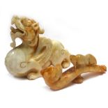 A carved white/sand jade figure in the form of a winged mythical beast, h.