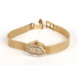 An 18ct yellow gold cased ladies wristwatch by Certina, the gold coloured oval dial with baton