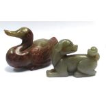 A carved mottled green/brown jade figure in the form of a duck, h.