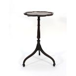 A 19th century mahogany wine table, the pie-crust top on a turned column with tripartite base, d.