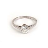 A platinum ring set single diamond in a raised eight claw setting, stone approx 0.