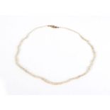 A single strand natural pearl necklace with 14ct yellow gold clasp set small diamonds,