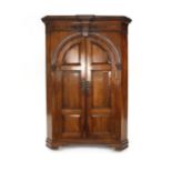 A George III mahogany and strung corner cupboard, the two panelled doors enclosing three shelves, w.