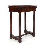 An Empire-style mahogany side table, the tray-type top over a single frieze drawer on four column