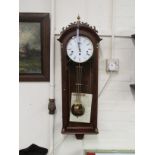 A modern Westminster chime wall clock, the enamelled dial with Roman numerals within a walnut and