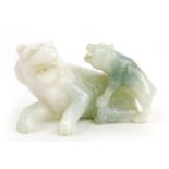 A Chinese carved hardstone group modelled as a tiger and cub, white to spinach green, h.