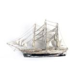 A metalware model of a three master vessel, h. 14 cm CONDITION REPORT: Some losses, lacking base