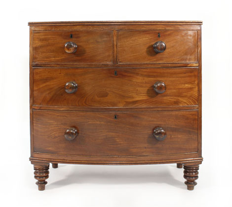 A Victorian mahogany bow fronted chest of two short and two long graduated drawers on turned feet,